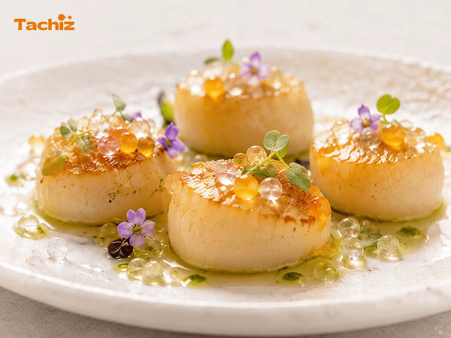 Oil-filled popping pearls served on gourmet cuisine dish