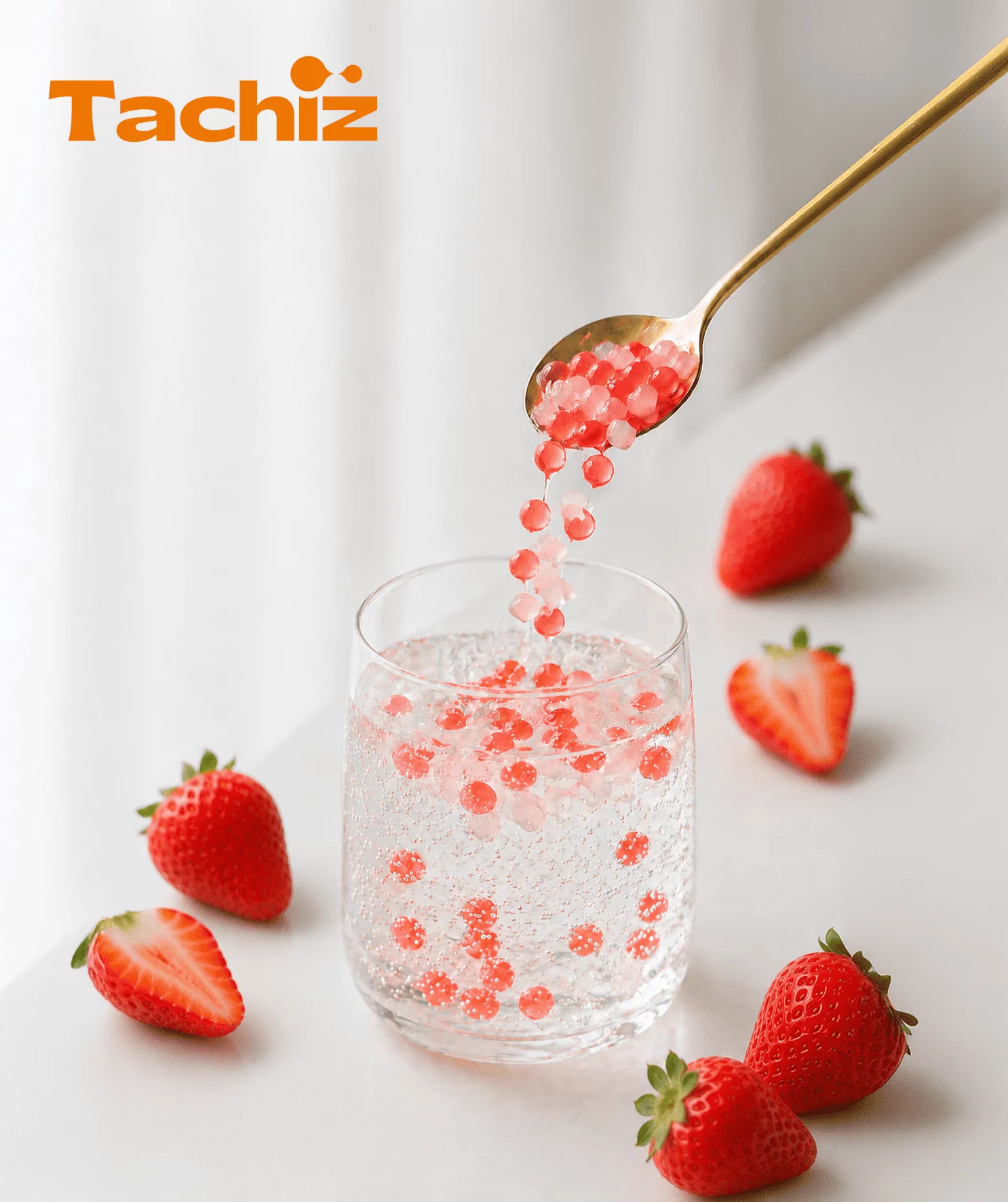 A refreshing summer strawberry sparkling mocktail featuring Tachiz popping boba, garnished with fresh mint and sliced strawberries.